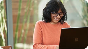 A woman working from home on her laptop.